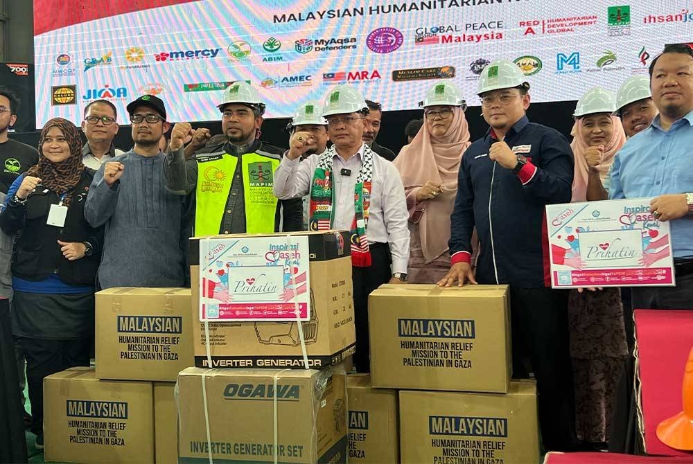 Mohd Na&#039;im bersama NGO yang terlibat dalam Ops Ihsan.