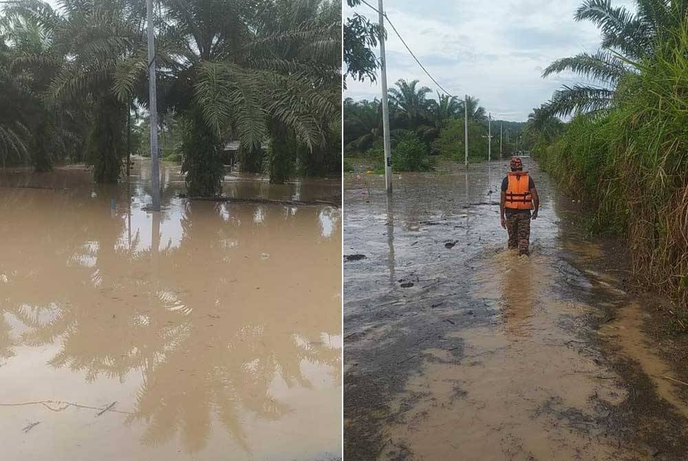 Anggota bomba mengharungi banjir di Lorong Mak Piah, Sungai Tiram untuk memindahkann penduduk ke PPS. - Foto Bomba