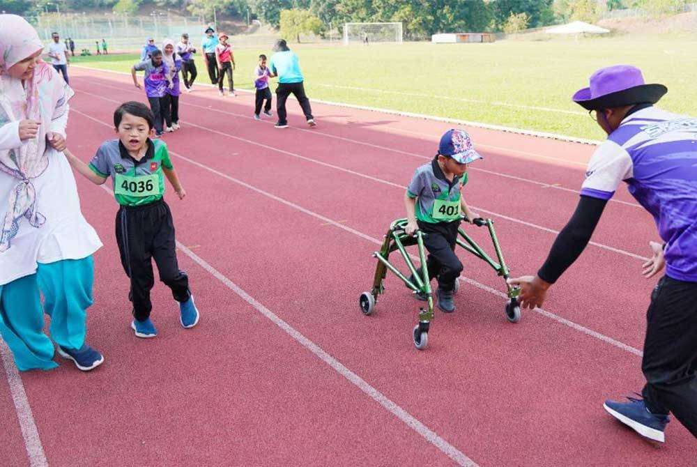 Kamal Nazrin muncul juara dalam acara larian 50 meter kategori PPKI. - Foto Rosli Talib