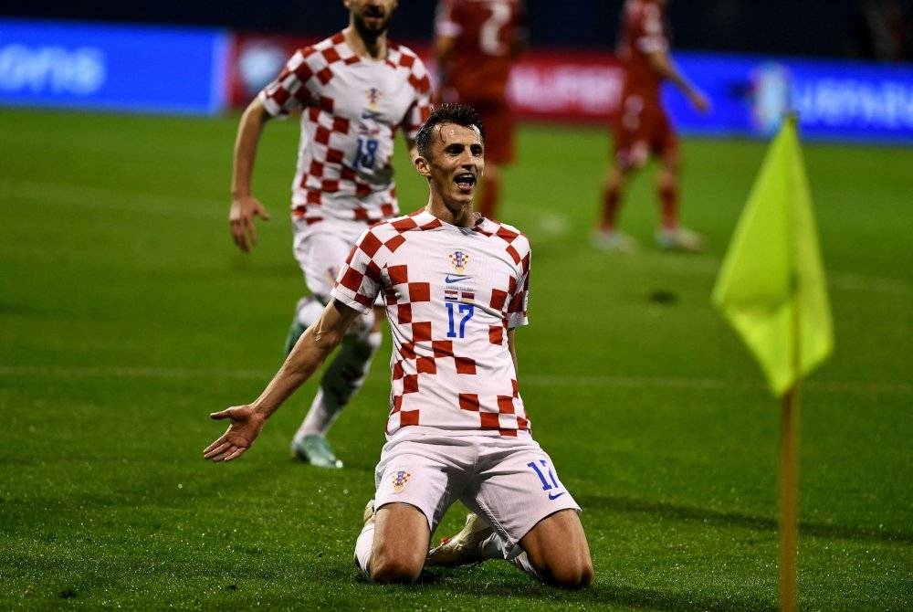 Budimir meraikan jaringannya ketika membantu Croatia menewaskan Armenia 1-0 di Zagreb awal pagi Rabu. - Foto AFP