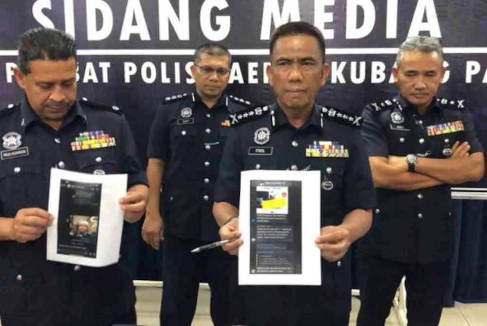 Fisol (tiga dari kiri) menunjukkan salinan hantaran yang dibuat oleh suspek ketika sidang media di IPD Kubang Pasu pada Jumaat - Gambar/ Astro AWANI