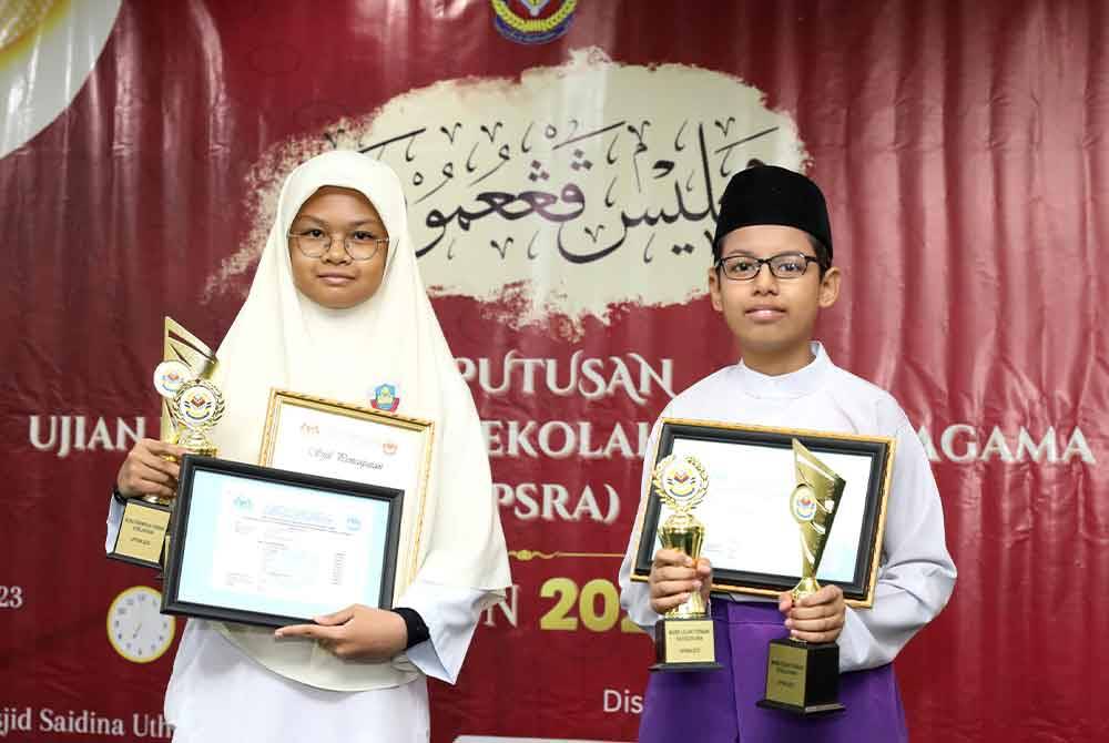 Muhammad Rayyan Rizqin (kanan) dan Safiyyah Puteri (kiri) dinobat murid terbaik UPSRA Wilayah Persekutuan.