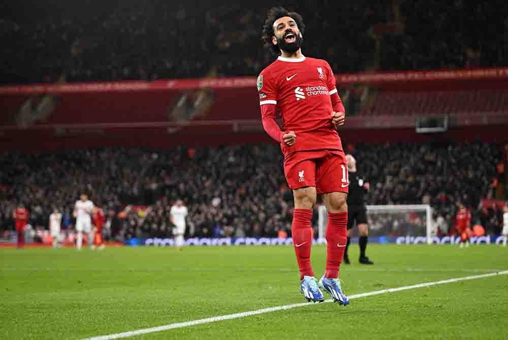 Reaksi Salah selepas meledak gol dalam pertemuan menentang West Ham. - Foto AFP