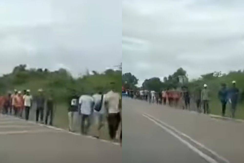 Tangkap layar video tular memaparkan warga Bangladesh berjalan di tepi jalan di Pengerang pada Rabu lalu.