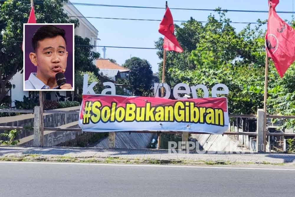 Kain rentang tersebut dipasang selama beberapa hari di sebuah jalan utama di Surakarta, Jawa Tengah. Gambar kecil: Gibran - Foto: Agensi/AFP (Gambar kecil: Gibran)