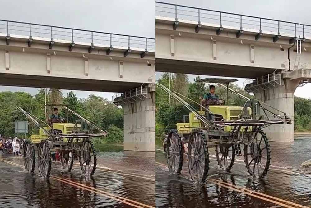 Amirul Faris menaiki jentera penyembur baja organik ketika meredah banjir di Durian Mentangau.