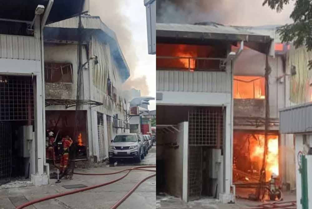 Anggota Bomba dan Penyelamat sedang memadamkan kebakaran di sebuah pusat servis kenderaan di Taman Segambut pada Ahad.