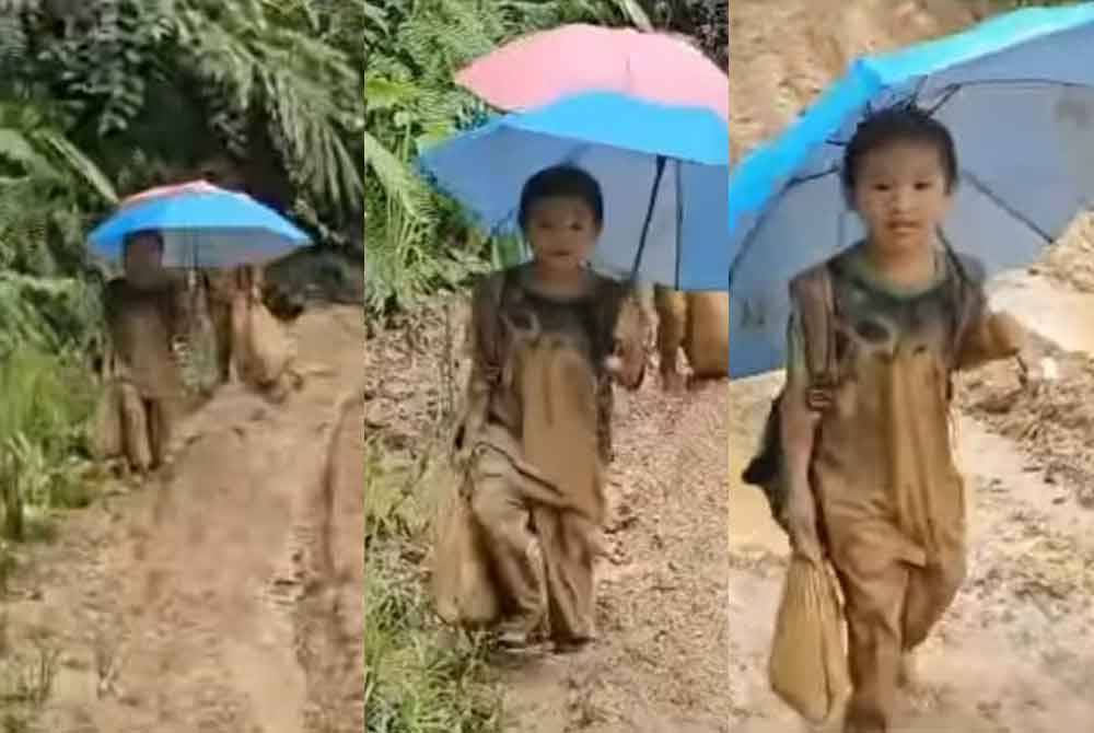 Murid terpaksa berjalan kaki di laluan yang berlumpur untuk sampai ke SK Magandai, Kota Marudu.