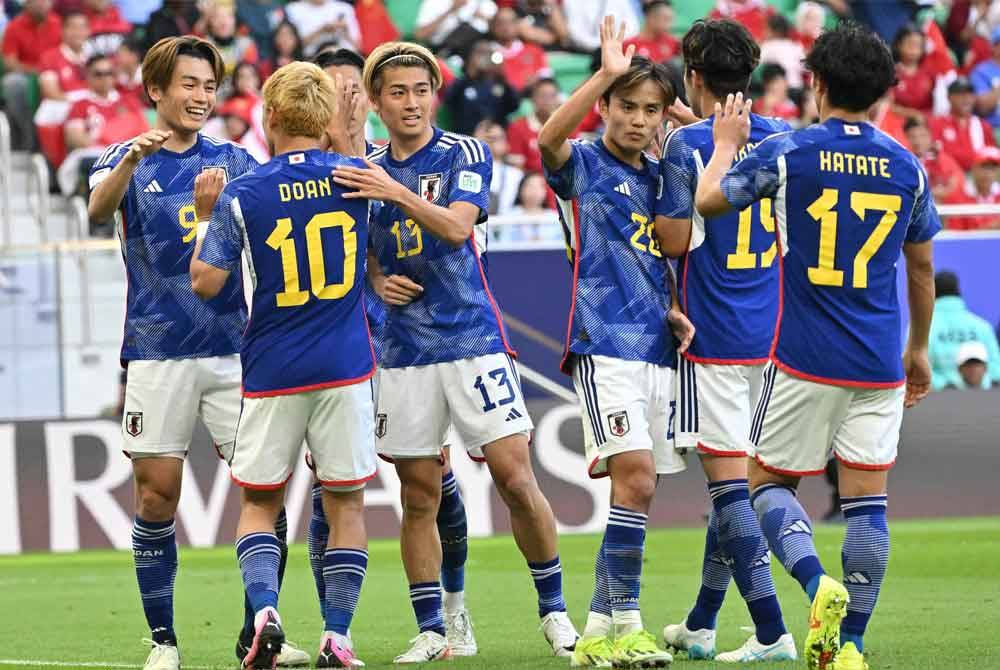 Pemain Jepun meraikan gol kedua mereka semasa perlawanan Kumpulan D Piala Asia 2023 menentang Indonesia di Stadium Al-Thumama. Foto AFP