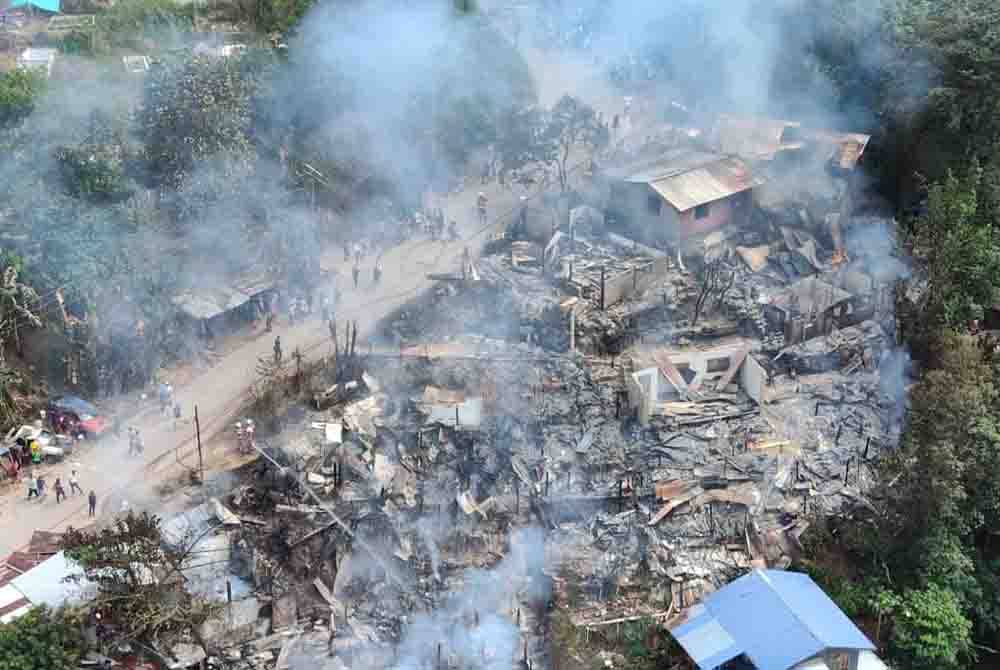 Kebakaran melibatkan 12 rumah setinggan di SPMP Telipok, Kota Kinabalu pada Selasa.