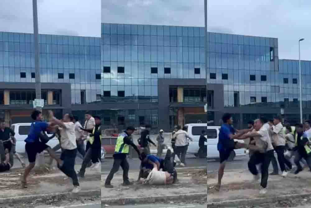 Tangkap layar memaparkan pergaduhan antara dua kumpulan di kawasan luar sebuah kilang di Kota Kinabalu.