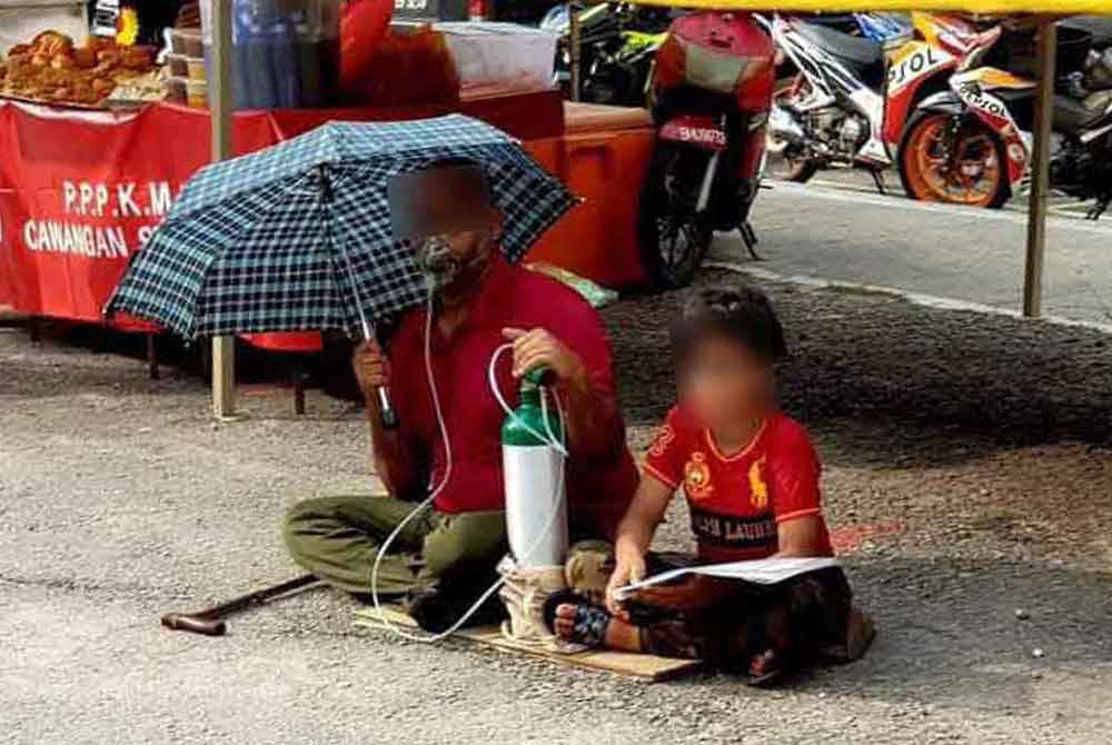 Warga asing yang tular meminta sedekah dengan bermodalkan sebuah tong oksigen ditemani seorang kanak-kanak.