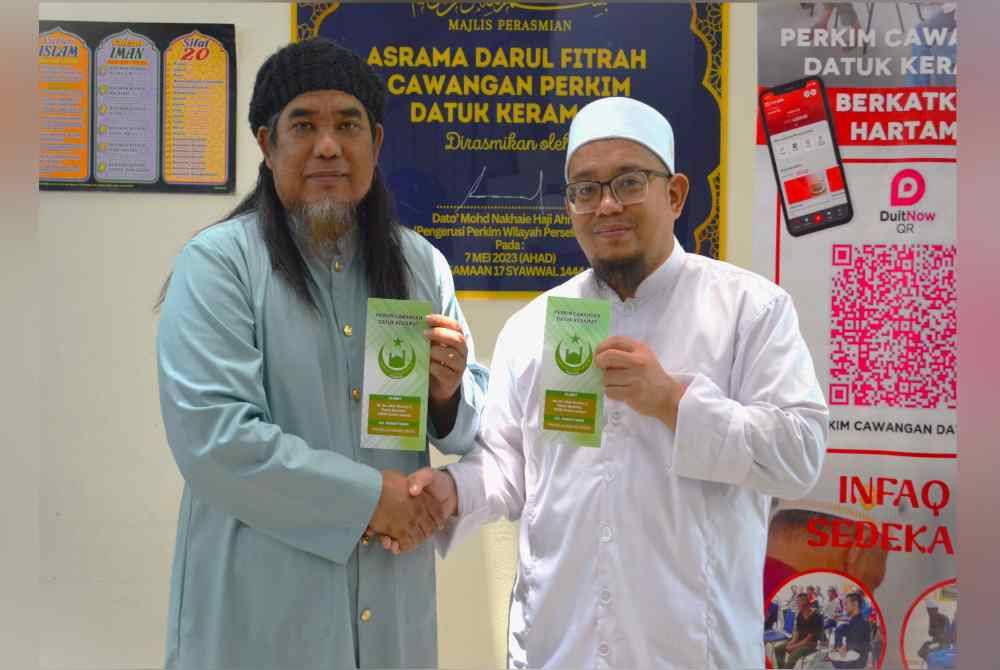 Daqmie bersama Pengerusi Perkim bahagian Datuk Keramat, Ustaz Mohamad Suhaimi Abdul Aziz.