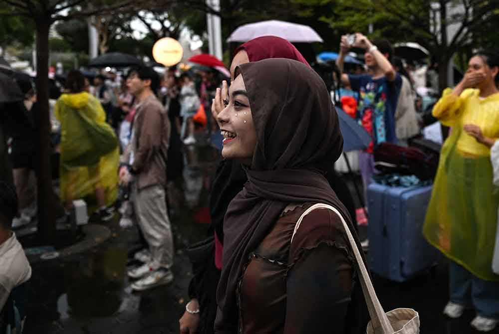 Singapura mengekalkan kedudukannya sebagai negara paling bahagia di Asia untuk tahun kedua berturut-turut. (Gambar hiasan) Foto AFP