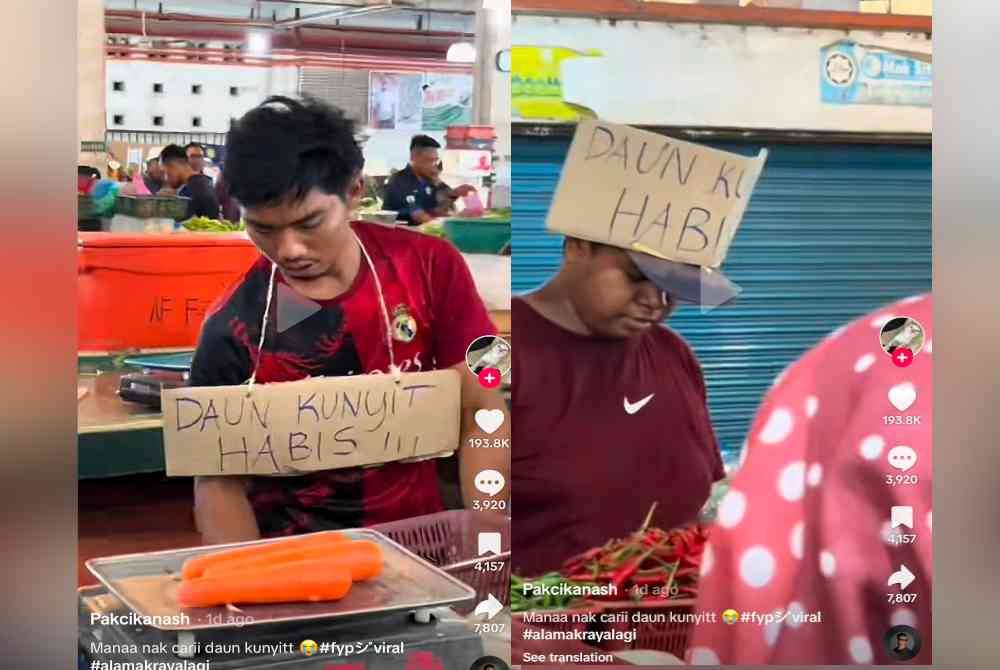 Penjual gantung dan lekatkan plakat tertera &#039;daun kunyit habis&#039; di leher dan kepala.