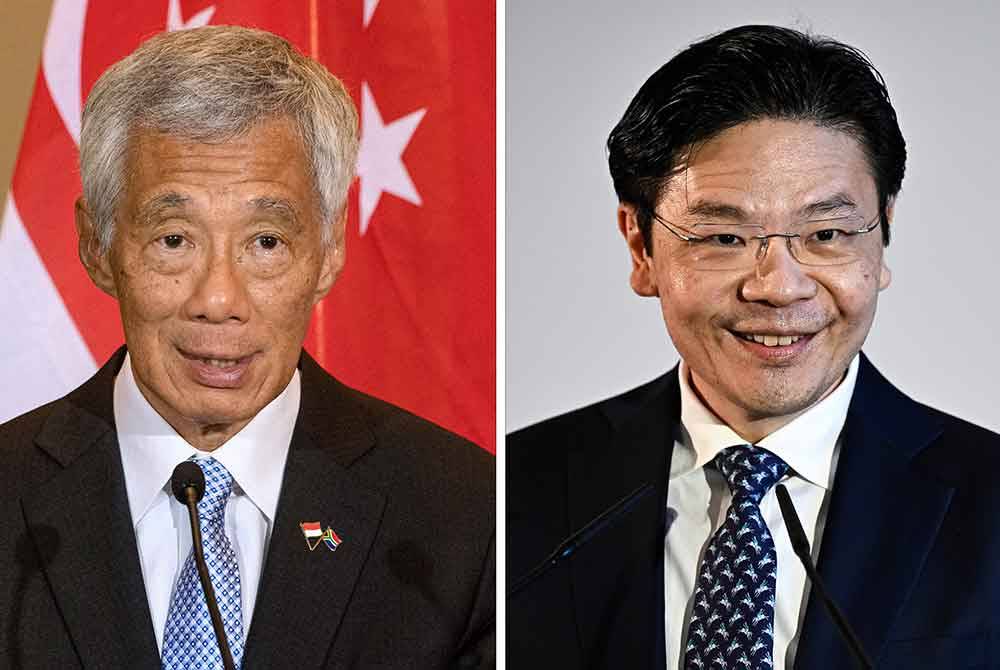 Lee Hsien Loong (kiri) dan Lawrence Wong. - AFP