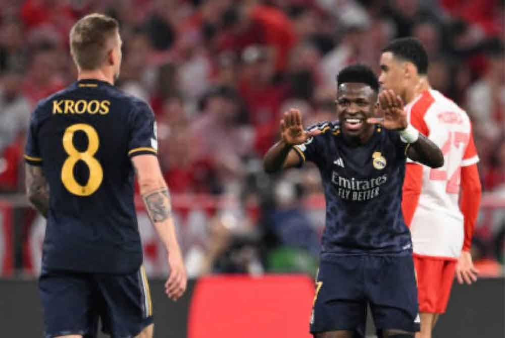 Vinicius (tengah) sumbang dua gol di Allianz Arena. Foto Agensi