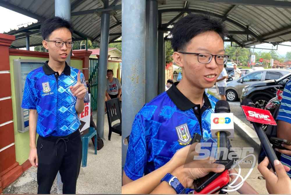 Yu Heng menunjukkan jarinya sebaik selesai mengundi di SJKC khing Ming, Kuala Kubu Baharu pada Sabtu.