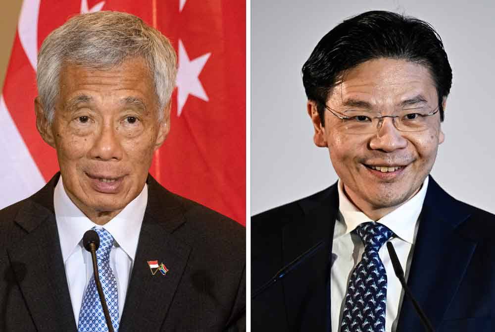 Lee Hsien Loong (kiri) dan Lawrence Wong. - AFP