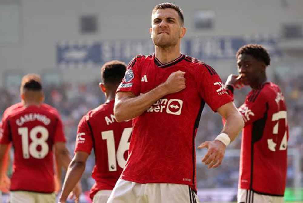 Diogo Dalot meraikan kejayaan menjaringkan gol pertama ketika perlawanan EPL antara Brighton & Hove Albion dan Manchester United di Stadium The American Express Community, Brighton, Britain, 19 Mei 2024. Foto Reuters