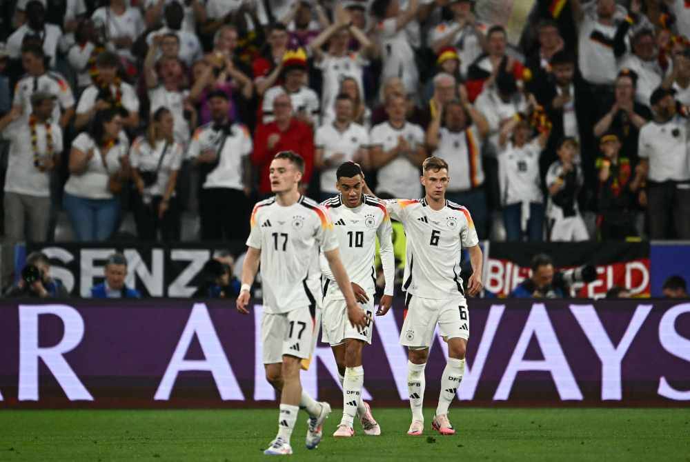 Musiala (tengah) meraikan jaringan kedua bersama Wirtz (kiri) dan pemain pertahanan Joshua Kimmich semasa aksi Jerman menentang Scotland di Munich. Foto AFP