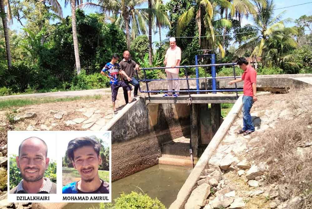 Penternak ikan air tawar Kampung Padang Durian menunjukkan paip sepanjang 50 meter yang digunakan untuk mengepam air dari telaga tiub ke tali air.