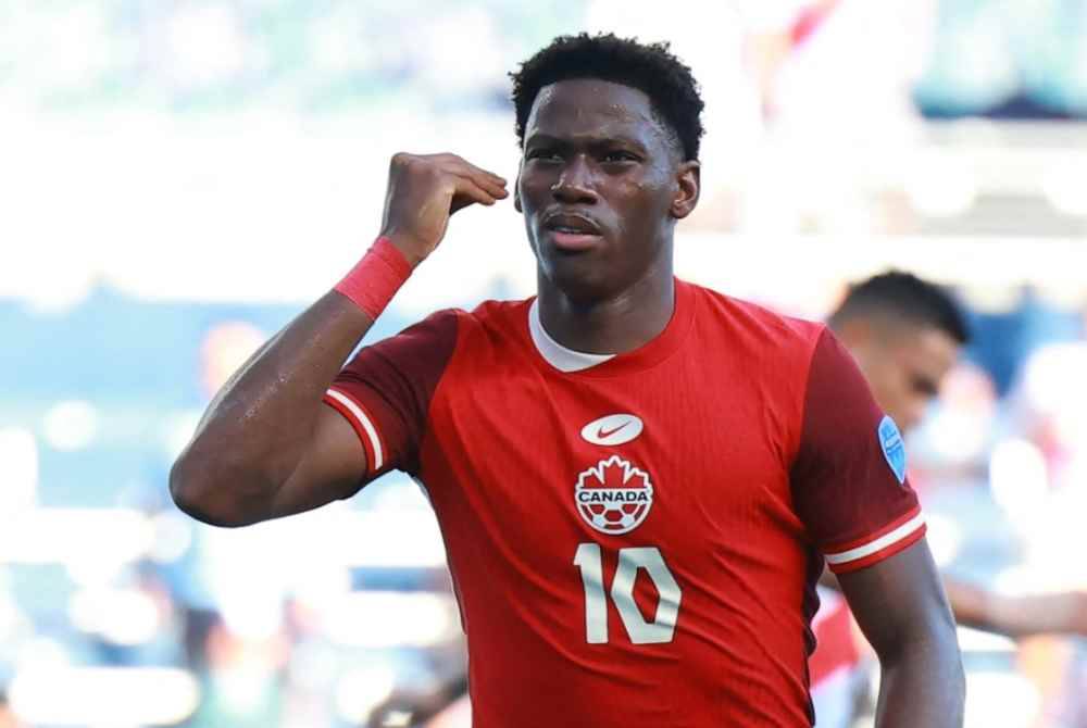 Jonathan David meraikan jaringannya ketika menentang Peru. Foto AFP