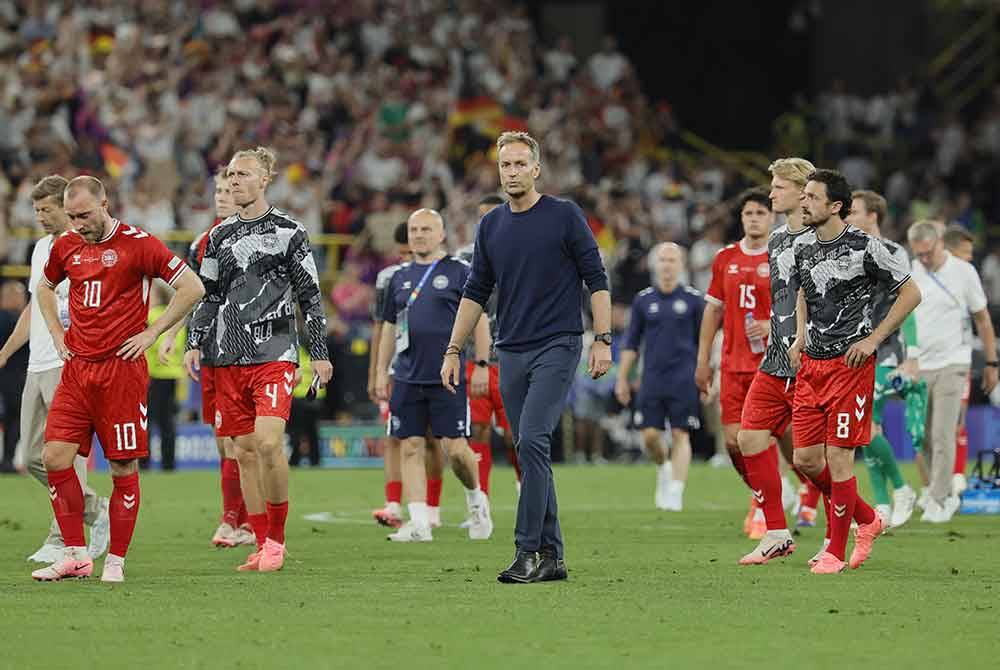 Reaksi Hjulmand (tengah) dan pemain Denmark selepas tewas kepada Jerman. Foto EPA