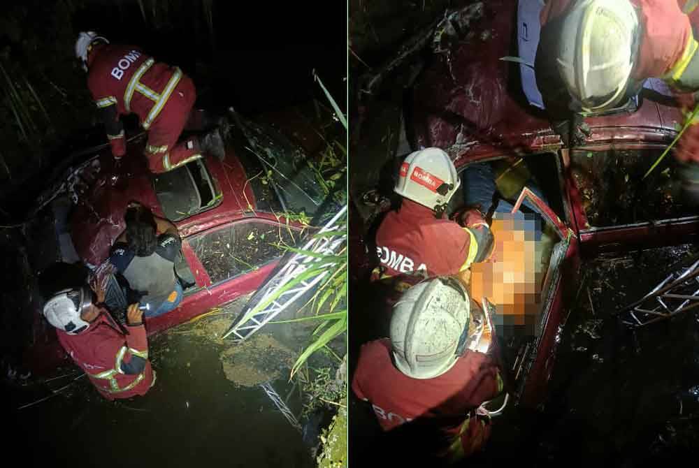 Anggota Bomba dan Penyelamat mengeluarkan mangsa yang terperangkap di dalam sebuah kereta yang terbabas ke dalam parit di Jalan Bukit Kemuning, Kota Kemuning, di sini, pada Ahad.