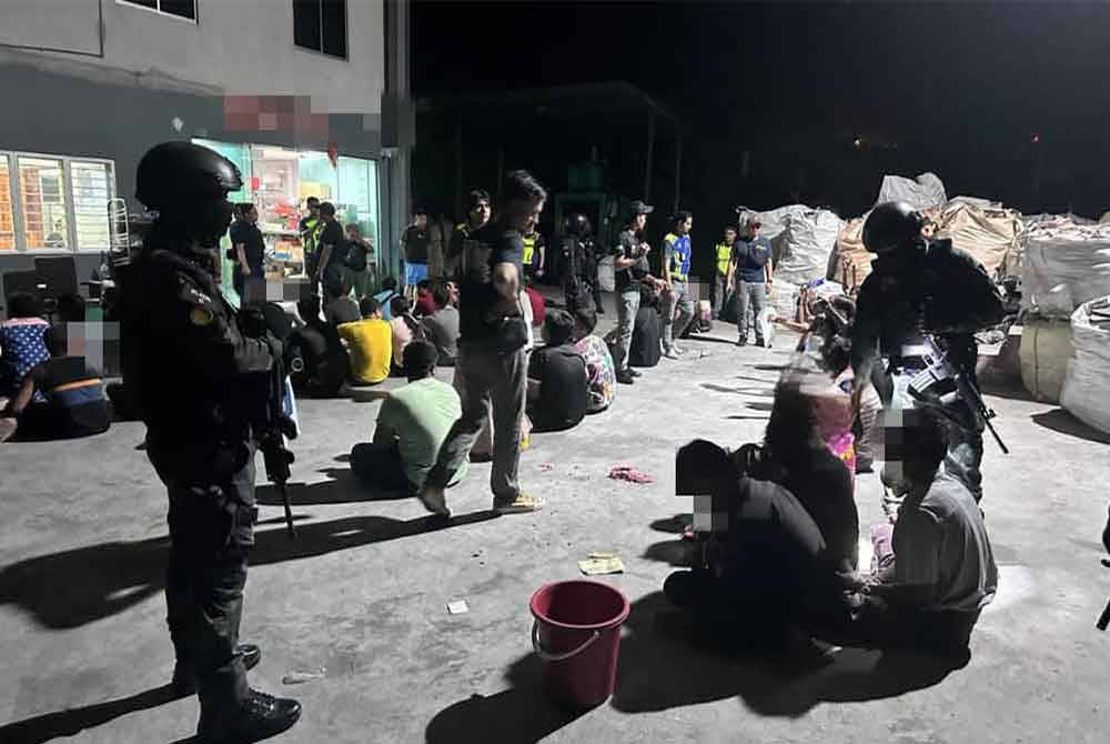 PATI yang ditahan hasil operasi bersepadu di sebuah kilang kitar semula di Bandar Tenggara, Kota Tinggi, pada Ahad. Foto IPD Kota Tinggi