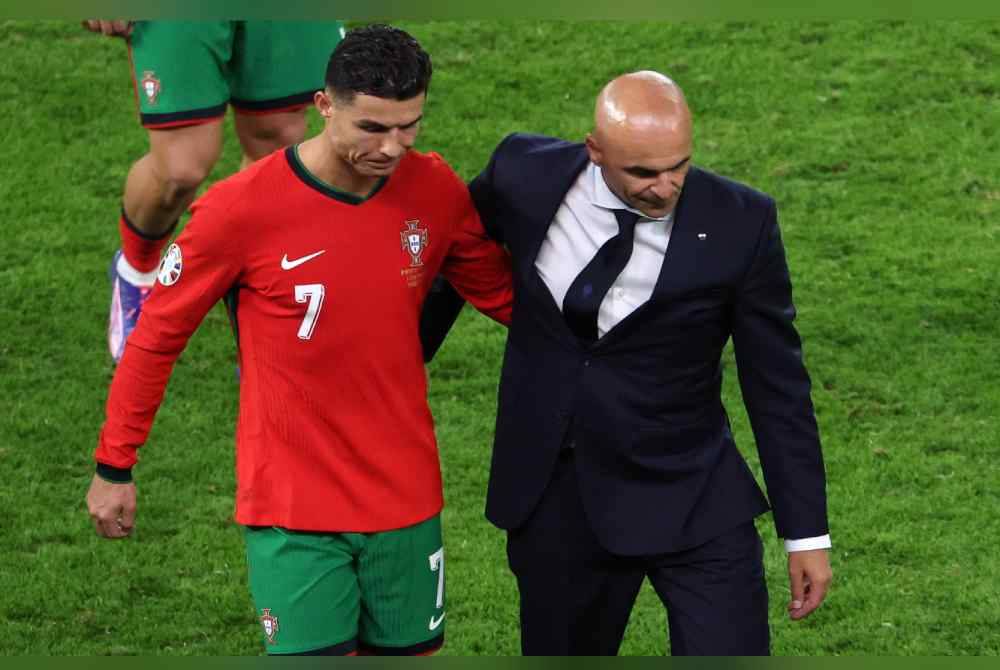 Reaksi Martinez (kanan) dan Cristiano Ronaldo selepas Portugal tewas kepada Perancis dalam aksi suku akhir Euro 2024. Foto EPA