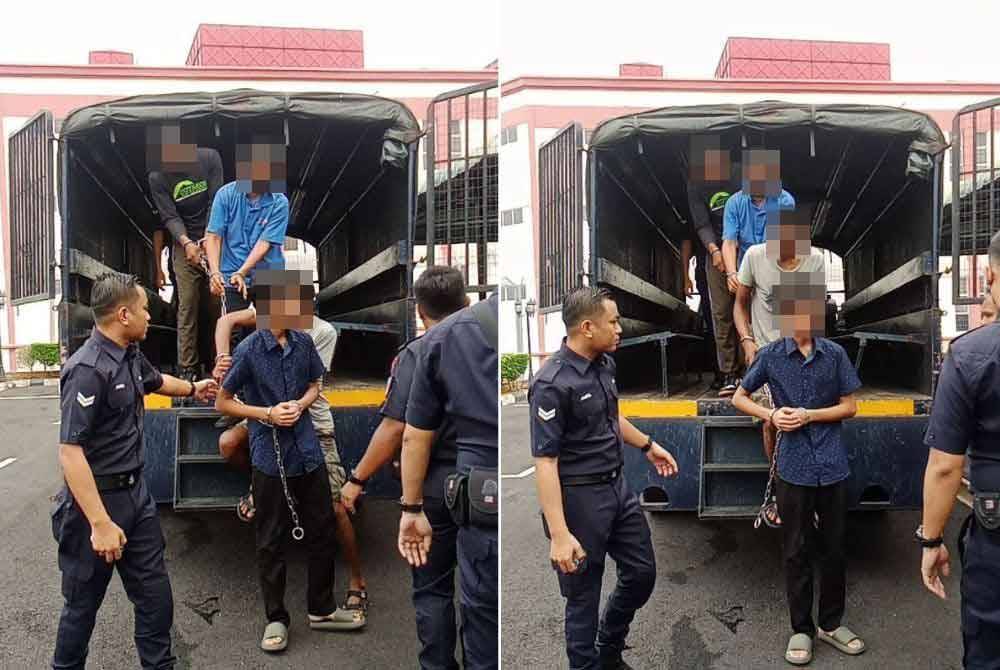 Tertuduh (kemeja biru) ketika hadir ke mahkamah diiringi anggota polis.