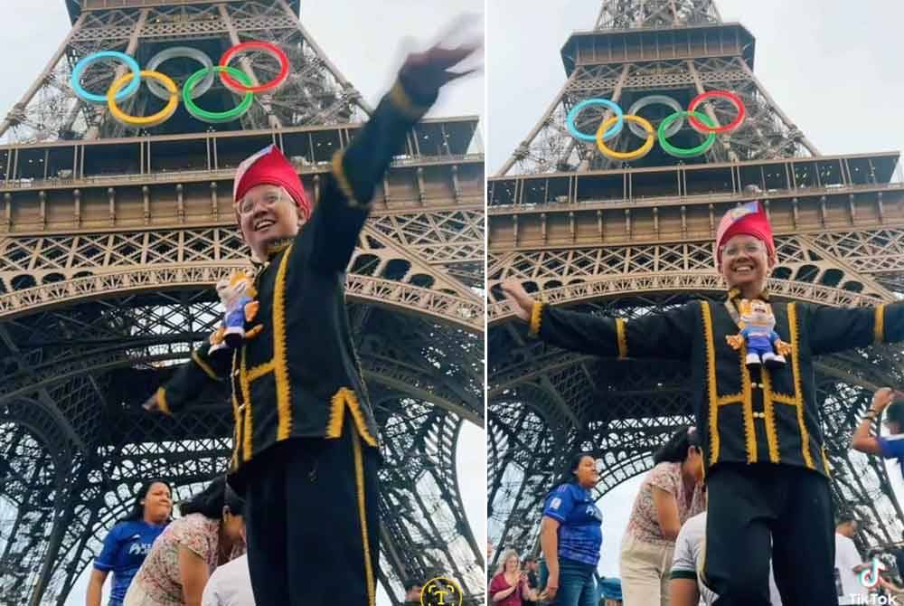 Ken Vun dengan pakaian tradisi suku kaum Kadazandusun menari tarian Sumazau di hadapan Menara Eiffel di Paris.