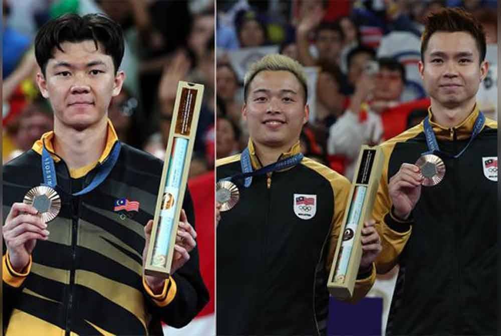 Zii Jia dan Aaron-Wooi Yik akan menerima hadiah wang tunai RM100,000 di bawah SHAKAM serta pencen RM2,000 seumur hidup selepas berjaya membawa pulang pingat gangsa pada Olimpik Paris baru-baru ini.- Foto Bernama