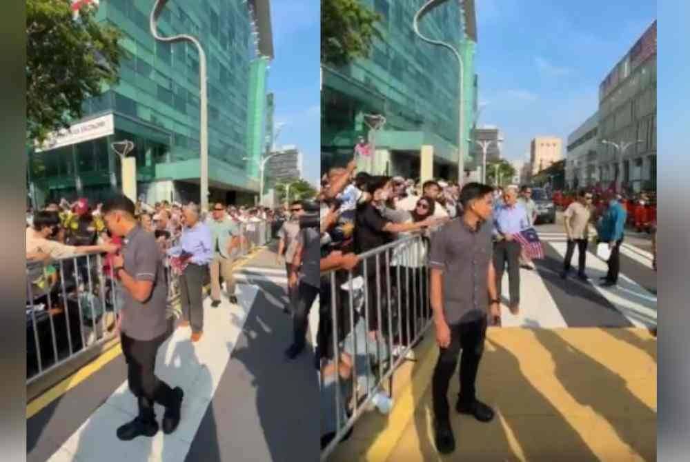 Tun Dr Mahathir beramah mesra dengan orang ramai di Dataran Putrajaya sempena sambutan Hari Kebangsaan 2024 pada Sabtu. 