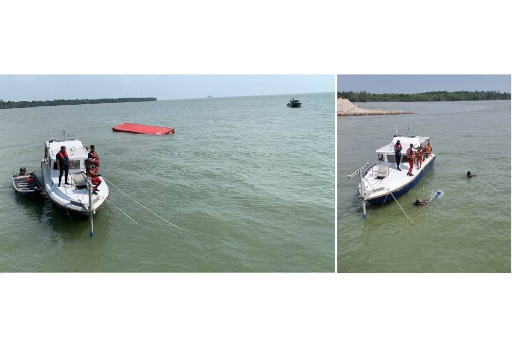 Usaha mencari mangsa giat dijalankan anggota bomba di Pelabuhan Barat pada Ahad.