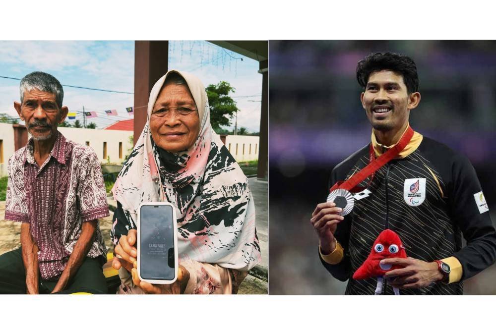 Salmah (kanan) ditemani Romly (kiri) menunjukkan gambar kemenangan anak lelakinya yang meraih pingat Perak Sukan Paralimpik 2024 Paris.