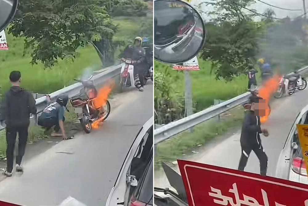 Tangkap layar video mangsa cuba memadam motosikal terbakar menggunakan selipar dan remaja lelaki berbaju hitam menghampirinya untuk membantu.