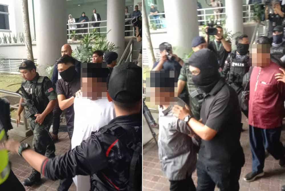 Anggota polis lengkap bersenjata mengiringi kesemua suspek ketika dibawa keluar dari pekarangan Mahkamah Majistret Shah Alam pada Rabu.