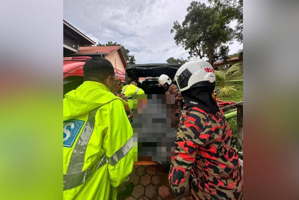 Mayat mangsa kemudian dibawa turun menggunakan kereta kabel sebelum dihantar ke unit forensik Hospital Sultanah Maliha untuk proses bedah siasat. Foto Polis