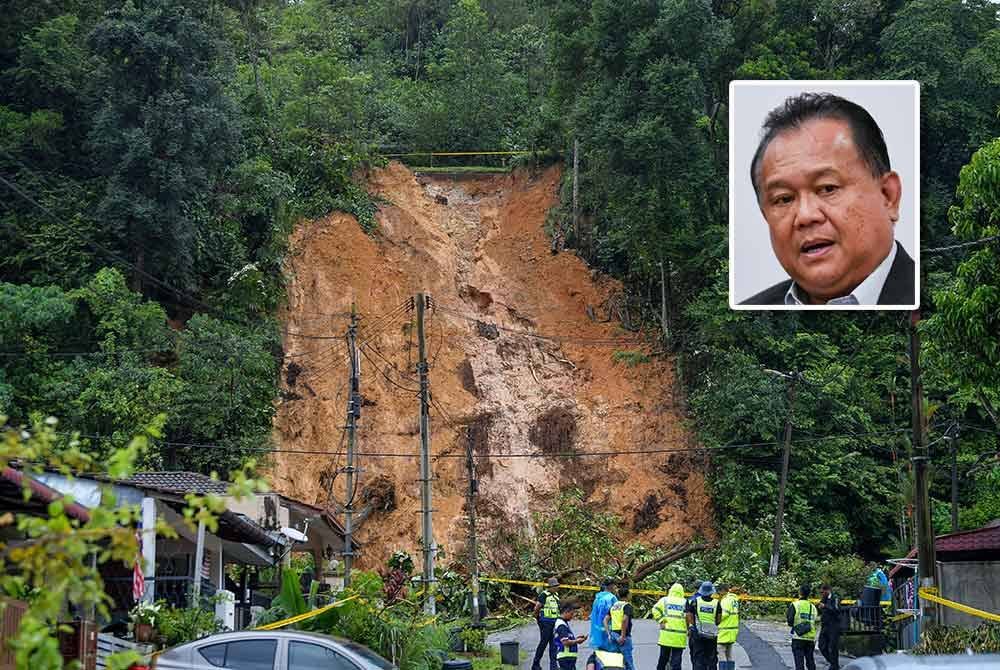 Keadaan tanah runtuh di Jalan E6 Taman Melawati sekitar 10.30 pagi tadi. Foto Bernama (Gambar kecil: Alexander Nanta Linggi)