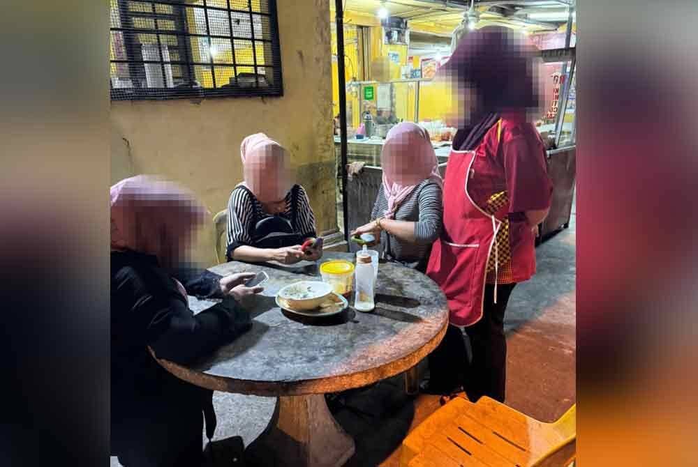 Penahanan pelayan kedai makan yang juga PATI di Kota Bharu. - Foto Ihsan JIM.