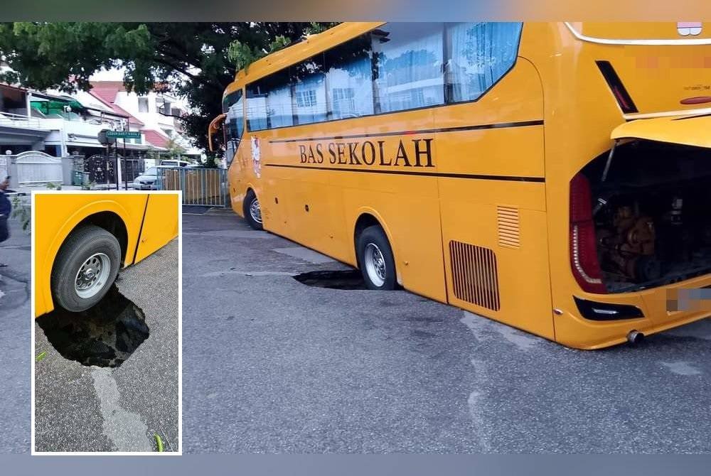 Tular gambar kejadian lubang besar yang berlaku di kawasan Pantai Jerejak hingga mengakibatkan tayar sebuah bas sekolah terbenam.