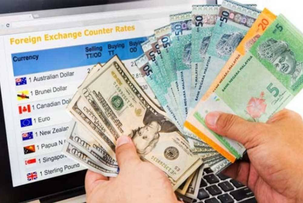 Ringgit meneruskan momentum positifnya untuk ditutup tinggi hari ini berbanding dolar AS. - Gambar hiasan