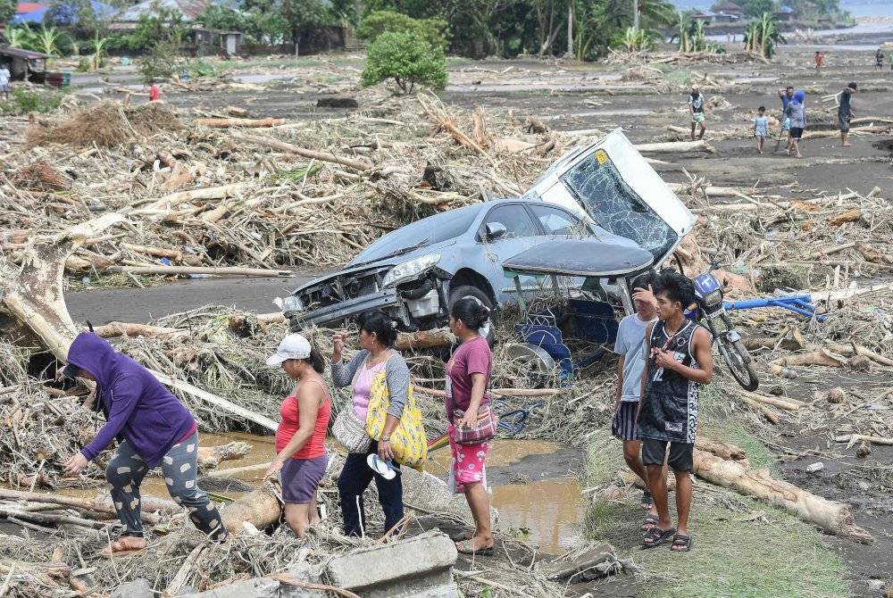 Angka korban akibat ribut tropika Trami yang melanda Filipina minggu ini meningkat kepada 90 orang. Foto AFP