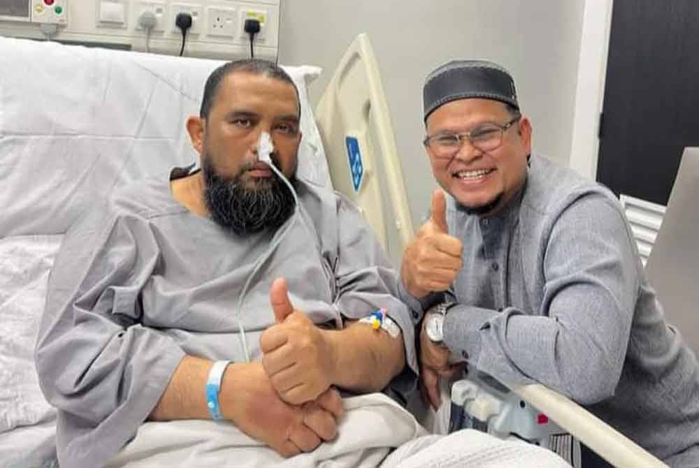 Ustaz Haslin Baharim yang jalani pembedahan akibat diserang angin ahmar, Jumaat lalu kini kelihatan semakin pulih namun masih berada di hospital. Foto Facebook Abdullah Khairi