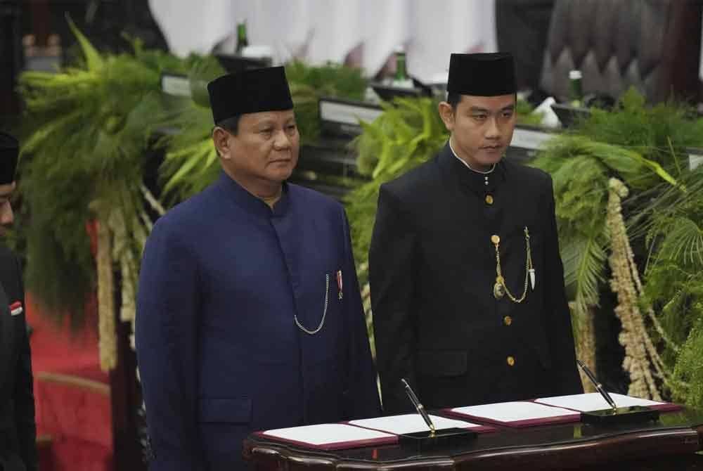 Duo Prabowo-Gibran menawarkan gabungan pengalaman dan keremajaan. - Foto Foto AP/ Tatan Syuflana