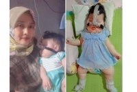 Afaharni bersama anak, Nur Aafiya yang menghidap spina bifida sejak lima bulan dalam kandungan.