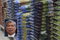 Harga beras putih import (BPI) di pintu gudang Bernas di Semenanjung diturunkan daripada RM3,000 kepada RM2,800 per tan metrik berkuat kuasa Ahad ini. Gambar hiasan. Gambar kecil: Mohamad Sabu