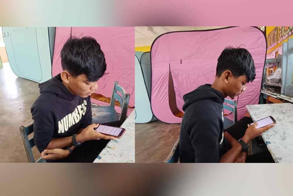 Muhammad Aidil Adwa Irfan tetap tekun mengulang kaji pelajaran menggunakan telefon pintar kerana tidak sempat membawa buku dan kelengkapan peperiksaan di PPS.